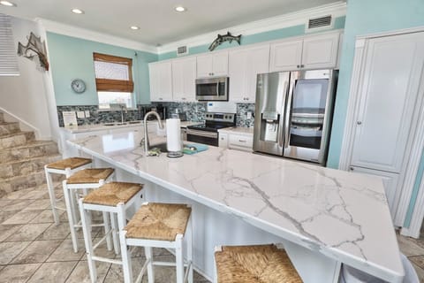 Huge island kitchen counter for preparing, entertaining, or just hanging out.