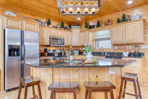 Island with barstool seating in the kitchen.