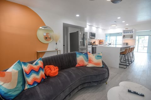 Bright, modern living space with a fun pop of color — a comfy spot to relax, connect, and unwind after a day of boating or poolside lounging