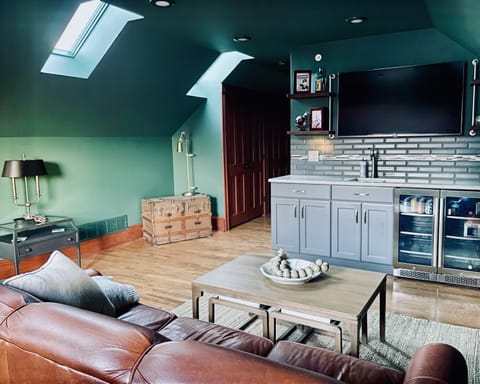 Head to the loft complete with wet bar, 55" TV and new queen sleeper sofa