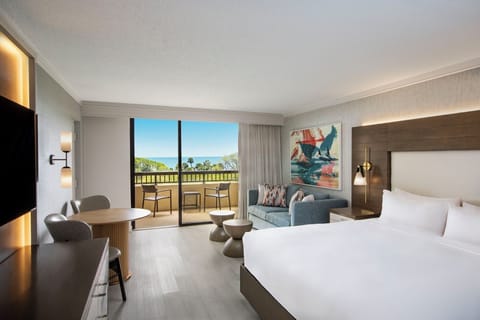 Wake up to ocean breezes from your bright, balcony-view bedroom.