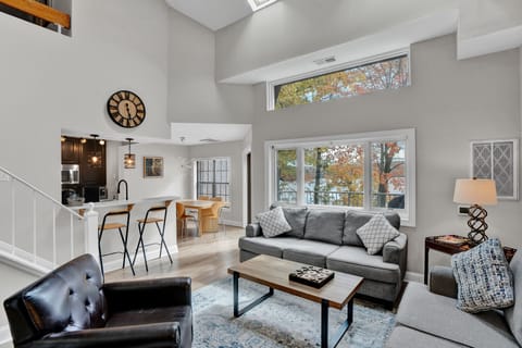 View towards kitchen and dining area from bright and airy living room. Nice view