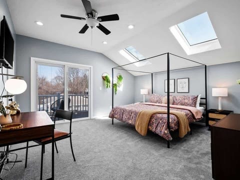 King sized bed located on the second floor. Cozy bedroom retreat with plush bedding and soft lighting.