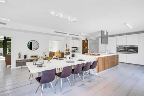 The dinning room with seating for for ten is just adjacent to the chef's kitchen.