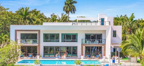 This exquisite waterfront modern villa embodies the quintessence o tranquility and serenity just a short 10 min walk to Bahia Mar beach and steps from