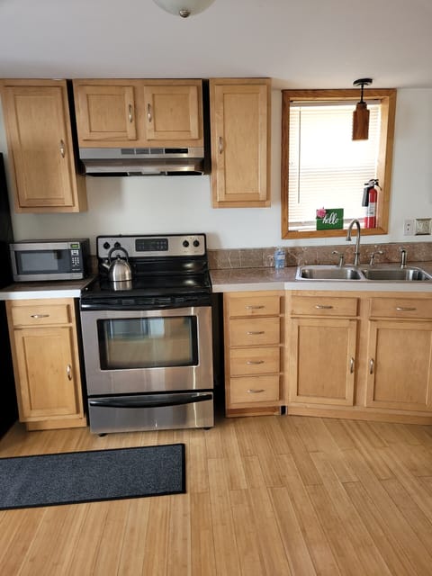 Modern kitchen with updated appliances and kitchen utensils.