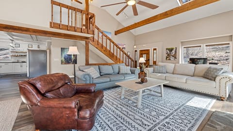 The main-level entertaining area. Plenty of seating and a dedicated workstation