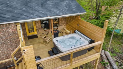 Private deck, hot tub, tabletop fire pit, & views of the bike trails!