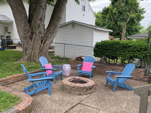 Four Adirondack chairs with fire pit.