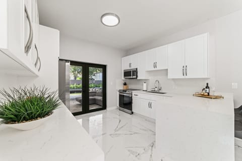 Indulge in the beauty of simplicity in our stunning kitchen oasis. 