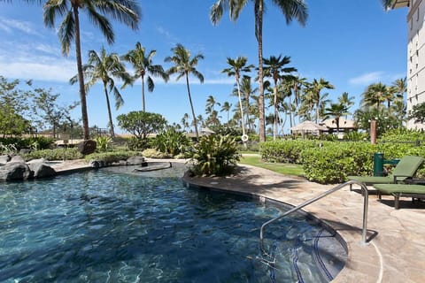 Lounge by the sparkling pool, feel the gentle ocean breeze