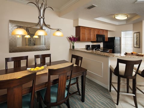 Gather and dine in style! Our dining area is ready for your memorable meals. Please note that photos may vary based on room assignment