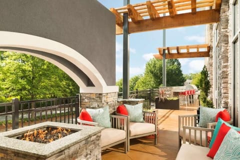 Gather by the fire pit on a stylish outdoor patio.