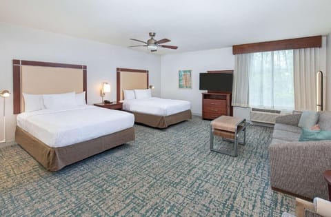 Unwind in a spacious suite with two plush beds.