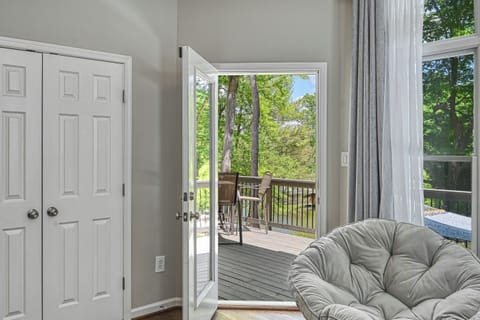 "Lakeside Retreat" master with access to the wraparound deck.