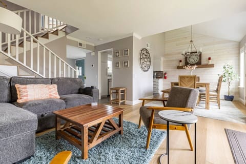 Downstairs living area with view of dining area.