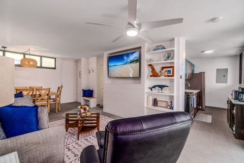 Spacious living room with clean, modern beach-inspired design.