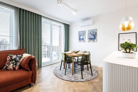 View of the dining table in the living room and the kitchen island