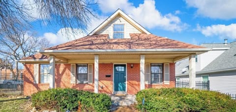 Discover the allure of this picturesque red brick house boasting a bold blue front door, a visual masterpiece that exudes warmth, character, and a touch of whimsy. ❤️ #HomeSweetHome #FrontDoorGoals #ArchitecturalCharm