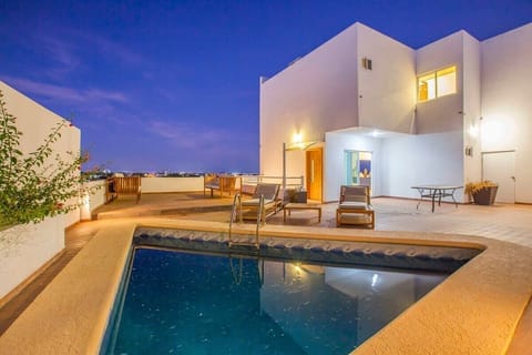 Pool with cocktails at night