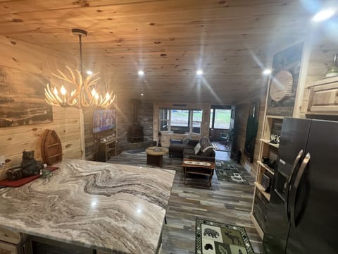 Kitchen looking into Livingroom and front porch area