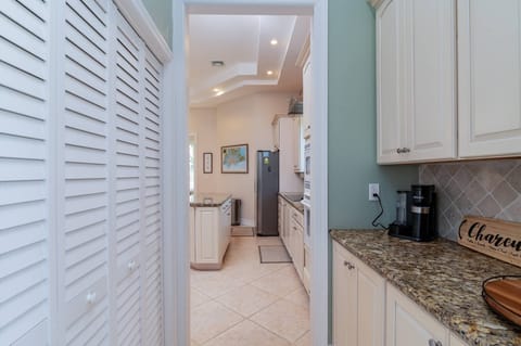 Pantry, coffee and wine station with view of the kitchen 