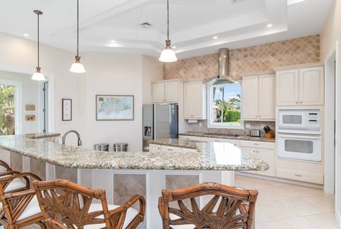 Kitchen and views of palm trees 
