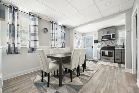 The rear door leads to a private parking space and the backyard. 