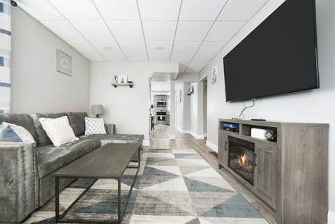 The living room on the ground floor faces the kitchen and dining area. 