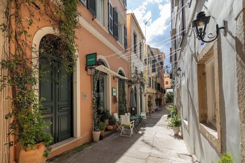 "Immerse yourself in the vibrant atmosphere of our neighborhood, lined with quaint shops and inviting cafes."