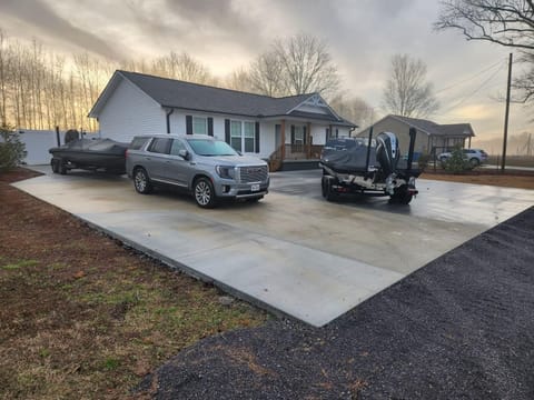 We’ve fit 4 boats 4 trucks and 2 cars on the concrete before.