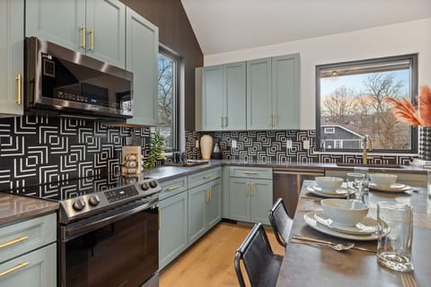 3rd Floor: Fully equipped kitchen stocked with your basic cooking essentials, stainless steel appliances, and dining area. (1st Floor)