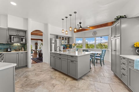 Gourmet kitchen with seating and views