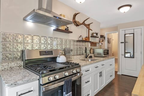 Experience culinary delights in this stylish kitchen