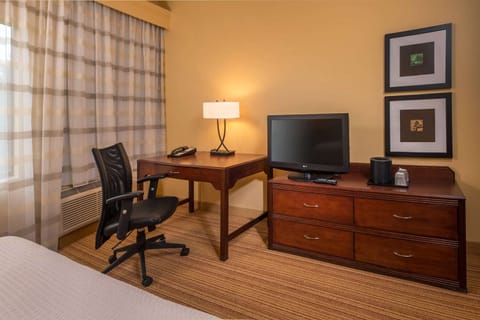 Stay productive at the spacious desk with in-room entertainment.