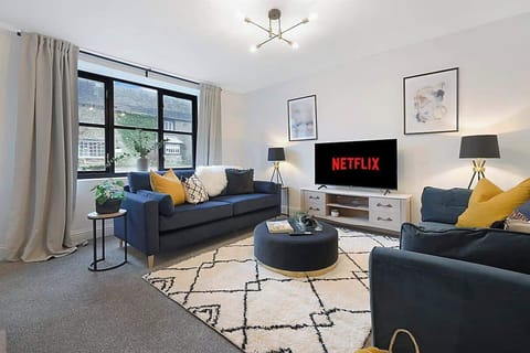 Spacious living room equipped with a SMART TV with Netflix, comfortable sofa bed and plenty  of space to sit down and relax. 