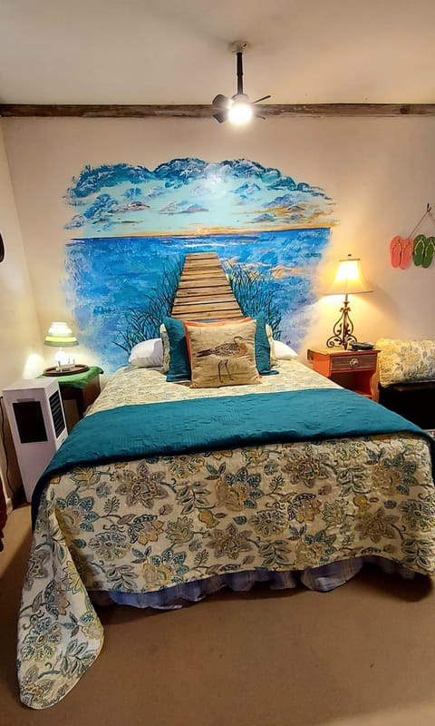 Painted headboard in 4th bedroom, with a bathroom, I like to get artsy!