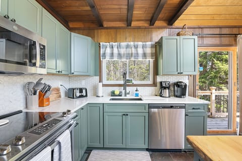 Brand New Kitchen!!  Fully renovated Winter '23/'24.  Fully Stocked with all essentials to prepare a meal!  Keurig and Traditional Coffee Pot, Crock Pot, Blender, Pots and Pans, Baking Sheets, Utensils.  Full place settings.