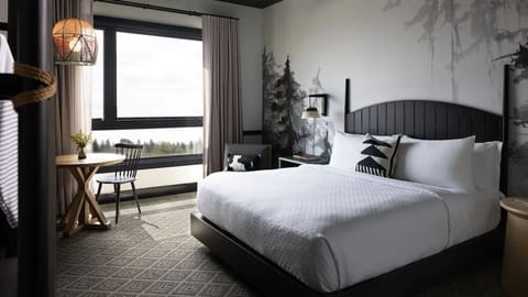 Wake up to big views from a serene, plush king bed.