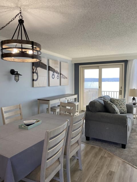 Dining and living area. Queen sofa bed in living room.