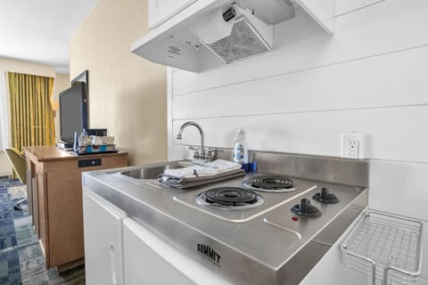 Cook simple meals with a handy cooktop and clean prep space.