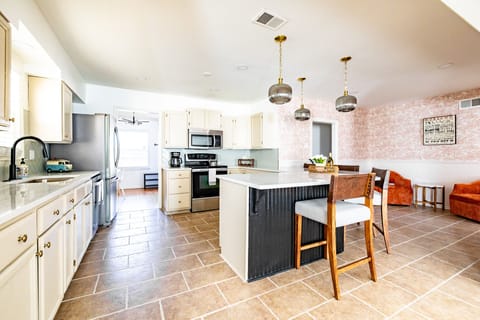 Large, open kitchen with all the essentials provided + seating options