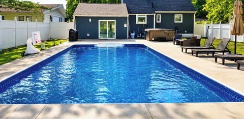 Relax in your private backyard oasis 🏊‍♂️🌿 Enjoy refreshing swims, lounge under the sun, and unwind in a peaceful, fully fenced space perfect for your getaway.