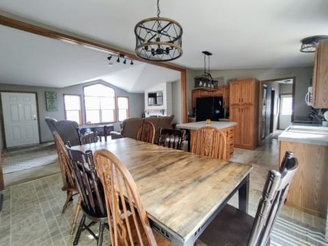 View to the lake including living area with fireplace and smart TV.