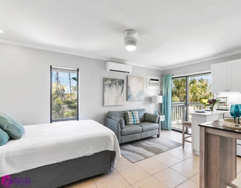 Queen bed, couch, ceiling fan, a/c, & private balcony