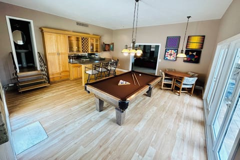 Game room w/ pool table, bar