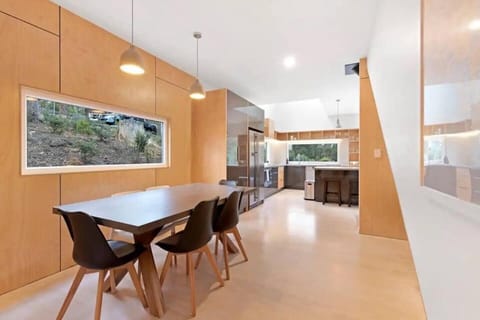 Dine in style on the chic table setting, with six chic black chairs adjacent the kitchen