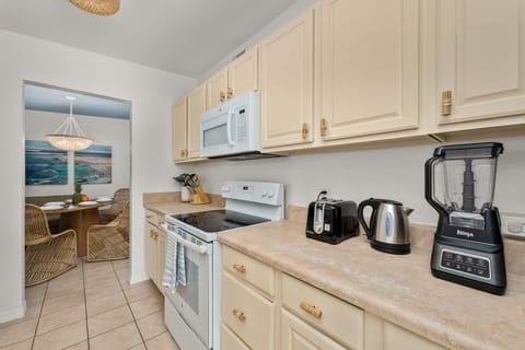 Kitchen is stocked for cooking enjoyment with ample storage and essentials.