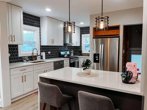 "Indulge your inner chef in our beautifully designed kitchen area."