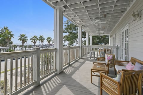 Step onto the private balcony of King Suite 202 and take in sweeping views of Pass Christian Harbor—perfect for morning coffee or sunset cocktails.